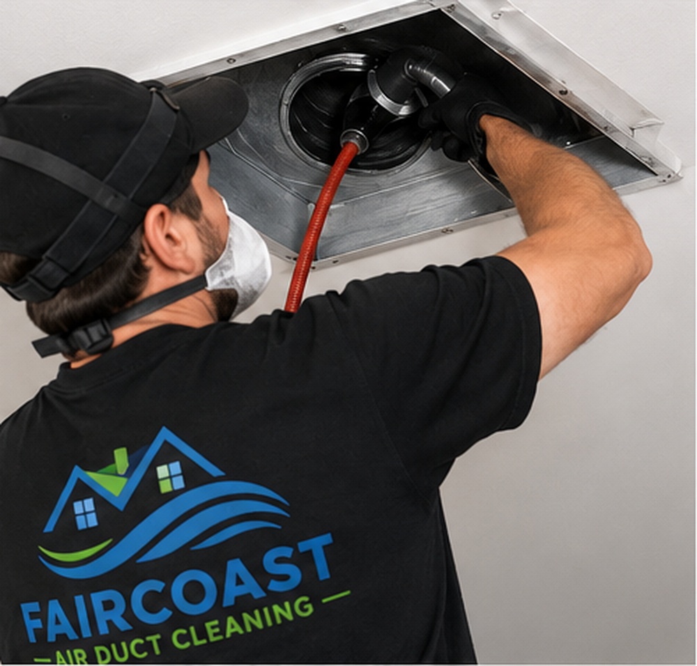 Faircoast technician connecting cleaning equipment to a residential air duct in Fairfield, CT